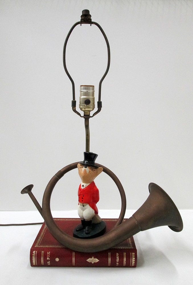 FOX HUNT REYNARD TABLE LAMP: Fox in red coat with large horn standing on a red book. 21" tall, 9" wide at base.