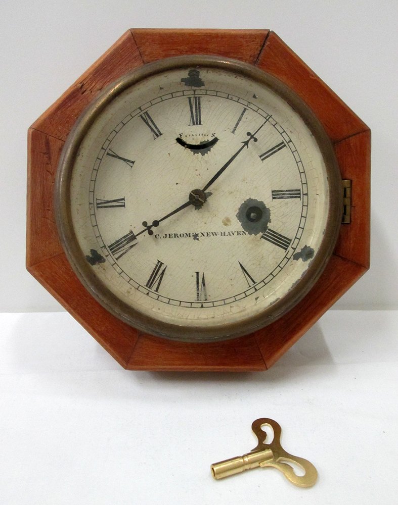 CHAUNCEY JEROME SHIPS CLOCK: 19th century C. Jerome octagon shape ship's clock. Circa 1850. Includes key, measures 8" x 8"