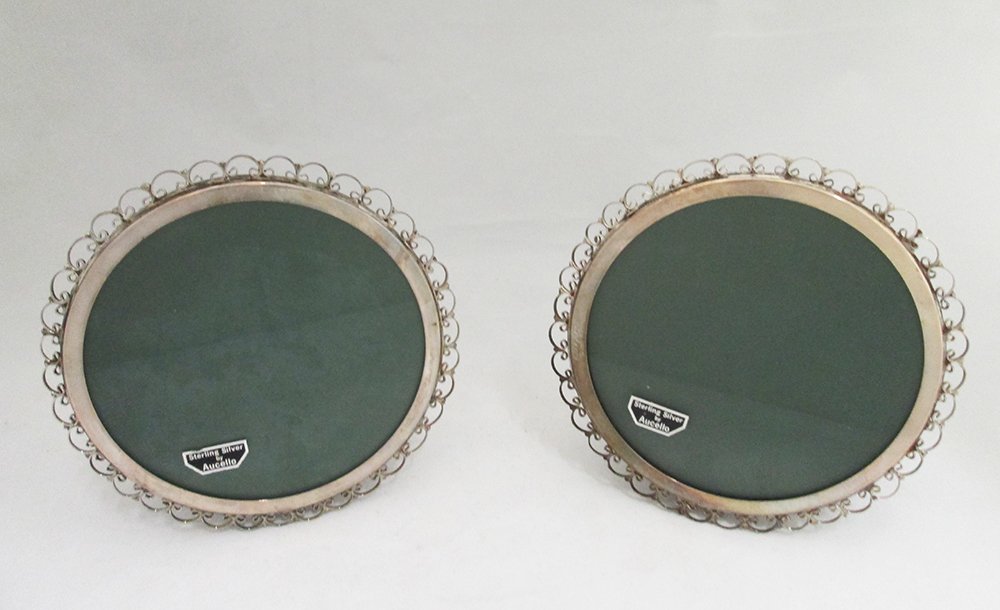 (2) STERLING SILVER PICTURE FRAMES: Two matching round sterling silver picture frames. 5 3/4" wide.