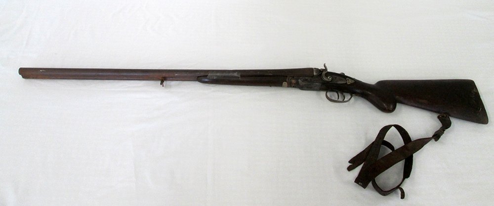 ANTIQUE BLACK POWDER DOUBLE BARREL SHOTGUN: Antique double barrel shotgun, unknown maker. Some wear from age, wood grip under barrel is loose. Shotgun has not been tested. Measures 46" long. Shipping will only be to a licensed FFL dealer.
