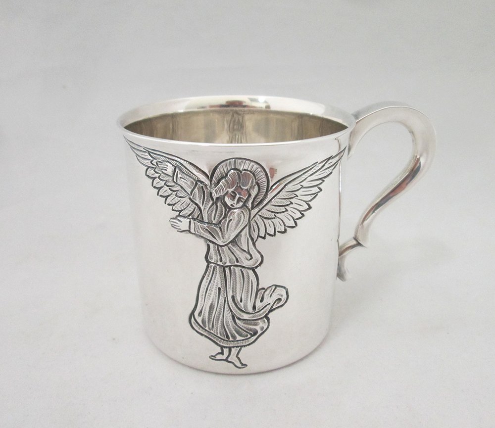 TIFFANY & CO STERLING BABY CUP: Tiffany & Company sterling silver baby cup with angel. Measures 2 3/4" Tall. Weighs 6.45 OZT.