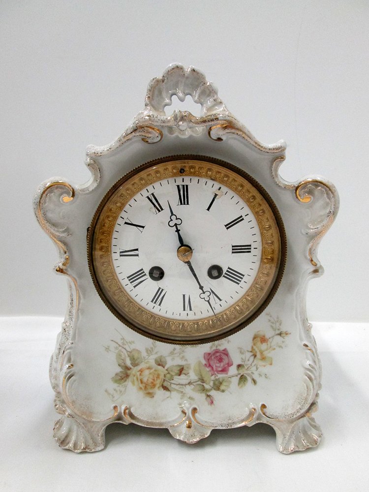 ANTIQUE KPM CHINA CLOCK: KPM porcelain china clock, white & blue with flower design. Includes key and pendulum. Measures 9 3/4" tall 7 1/2" wide.