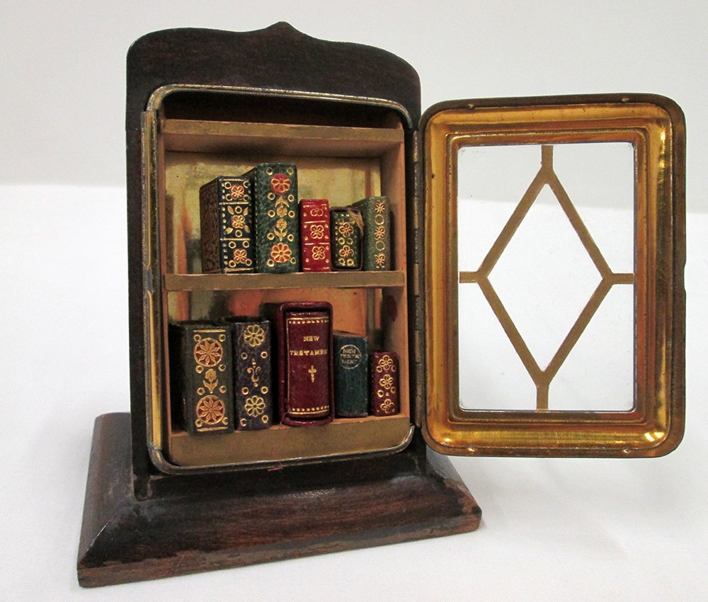 ANTIQUE MINIATURE BIBLES & BOOKCASE: Collection of miniature bibles, prayer books, & more. Glascow David Bryce & Son and more. Bookcase 4" tall. Mostly bibles & prayer books. Some books unmarked. Provenance: Robert Lloyd Henderson Collec