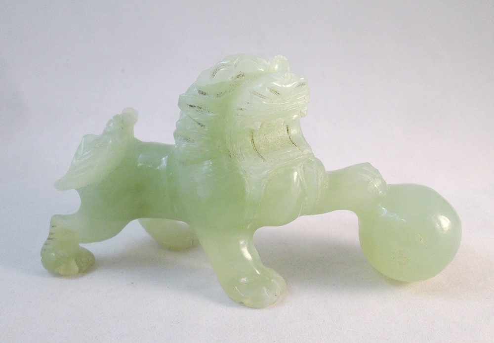 CHINESE JADE FOO DOG CARVING: Green jade foo dog lion with ball. 3 1/4" tall 6" wide.