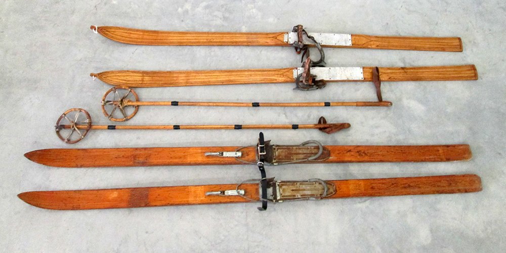 VINTAGE WWII WOODEN SKIS & BAMBOO POLES: 2 pairs of wooden skis. One is marked Allgau and the other pair is marked Gustav Steidel. Also included is a pair of bamboo poles.