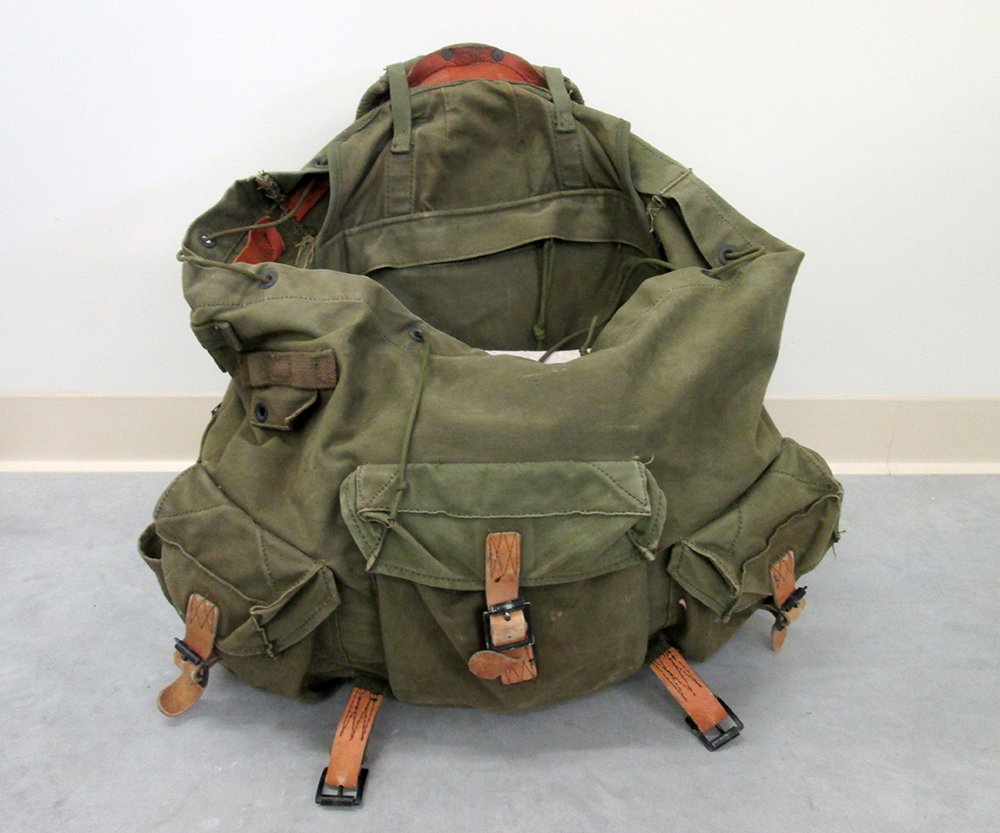 WWII ARMY RUCKSACK FROM "DEVIL'S BRIGADE" MOVIE: SFC Bollinger was one of the extras that played in the film Devil's Brigade. He was a member of the of 10th Special Forces Group that were used during the filming. Included with the backpack is a cant