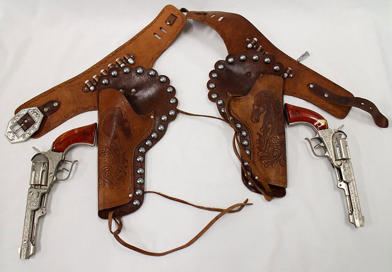 HUBLEY PIONEER CAP GUNS: Pair of Hubley Pioneer cap guns with holsters.