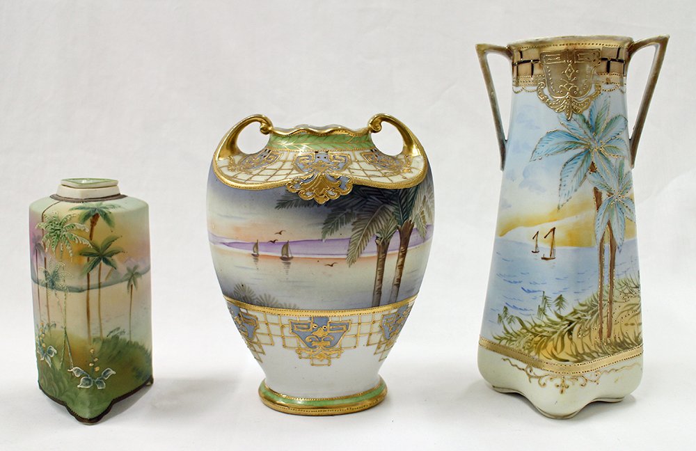 NIPPON VASES & TEA CADDY: Three antique pieces of hand painted Nippon. Two double handled vases and one tea caddy. Each piece has a tropical palm tree and ocean design. 9 1/2" 7 1/2" and 6" tall.