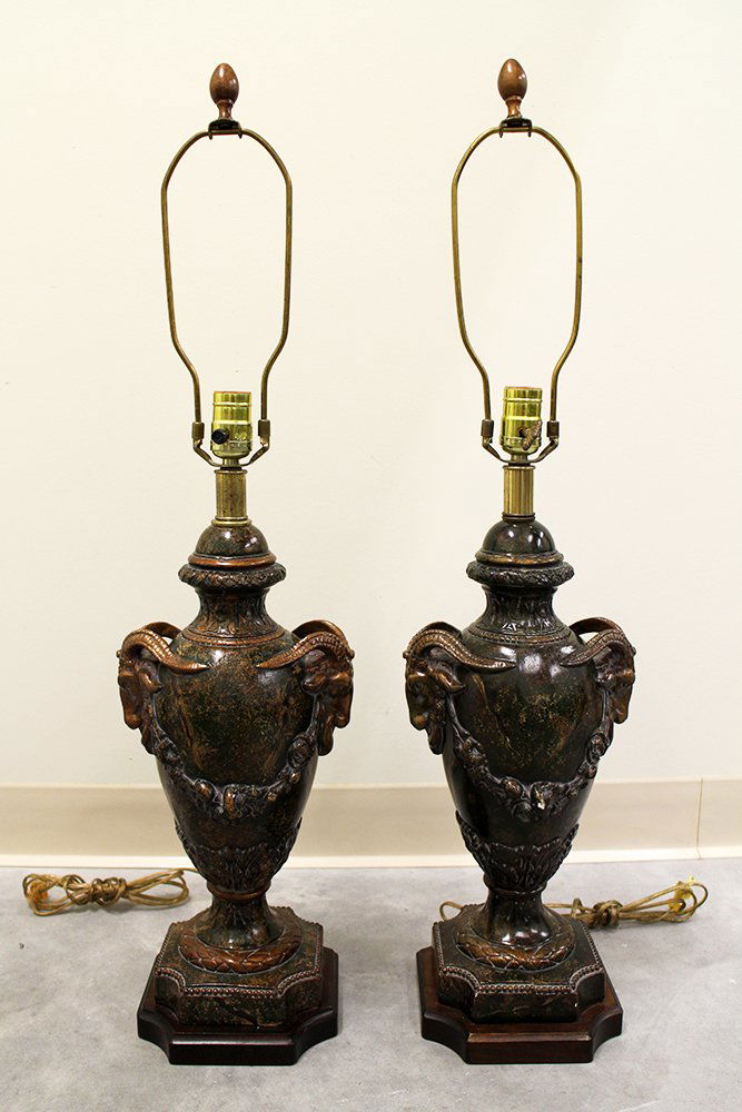 (2) FREDERICK COOPER LAMPS: Pair of Frederick Cooper lamps, each with two rams heads facing outwards. Lamps have a green & gold color. Some wear & light paint loss, two chips (could be touched up with paint). Lamps measure appro