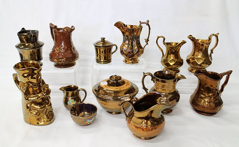 ENGLISH COPPER LUSTERWARE: Nice collection of 20th century copper luster to include a toby mug, a pitcher with a griffin handle, creamer, sugar bowl, covered bowl and more.