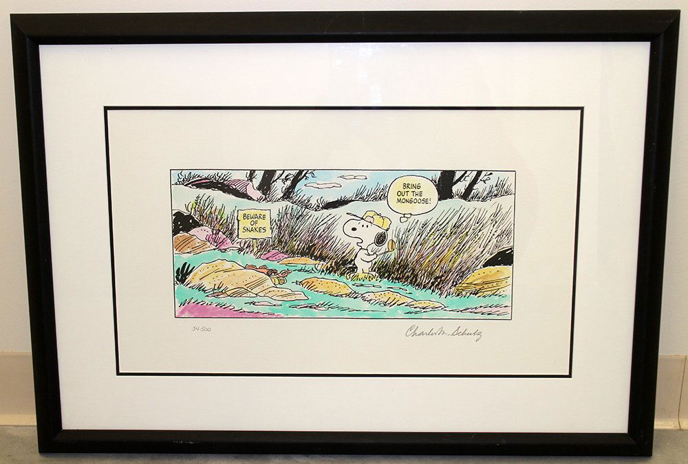 CHARLES SCHULZ SIGNED LITHOGRAPH: Charles Schulz Peanuts Snoopy lithograph. Lithograph is snoopy golfing and worried about snakes in the bushes. Signed lower right and numbered lower left. Picture is 16" x 7" and 30" x 21" with frame.