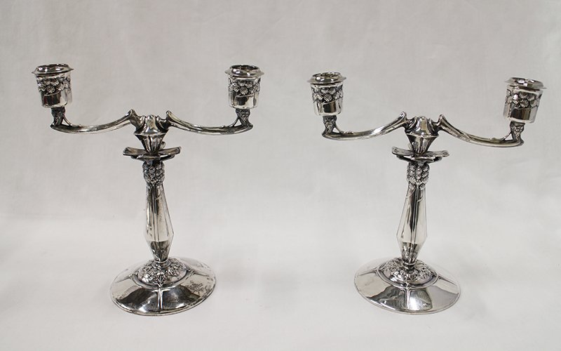 (2) 800 SILVER CANDELABRAS: Pair of hallmarked 800 silver two arm candelabras. One has a solder repair. Each measures 8 3/4" tall 8 1/4" wide.