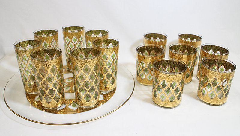 (14) VINTAGE CUVER VALENCIA GLASSES: Mid century 22K gold trimmed glasses signed Cuver. There are (7) highball glasses 4" tall and (7) tumblers 5 1/2" tall.