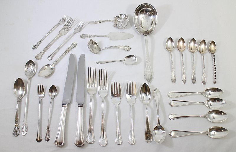 LARGE COLLECTION OF STERLING & SILVER FLATWARE: 30 pieces of Sterling silver & more collection of flatware including forks, knives, spoons, and serving pieces. 25 pieces marked sterling and weigh 20.13 OZT. Four pieces marked 830, one coin silver, 
