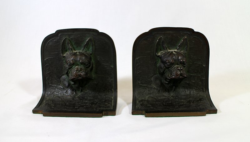 BRONZE BOXER DOG BOOKENDS: Pair of bronze boxer dog head bookends. Bookends measure 4 1/2" tall 4 1/2" wide.