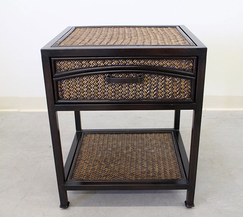 SIDE TABLE: Wicker style side table with one drawer. Table measures 34 1/2" tall 20" x 18" wide.