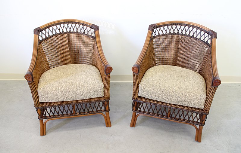 RATTAN ARMCHAIRS: Pair of rattan armchairs. Chairs measure 36" tall 28 1/4" x 24" wide.