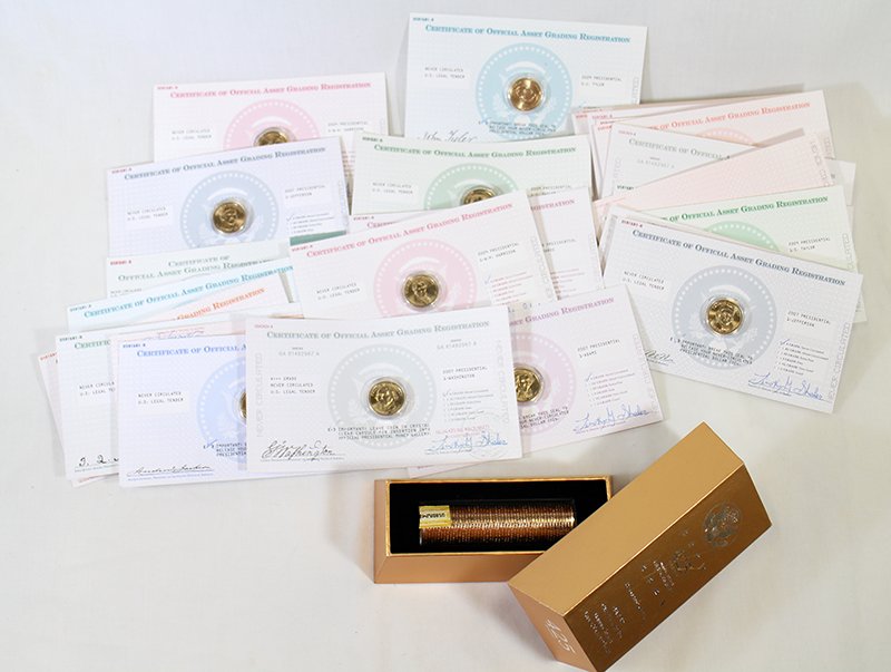 UNCIRCULATED PRESIDENTIAL DOLLAR COINS: Collection of uncirculated United States Presidential dollar coins including a 425 net grains ballistic roll with box and (26) coins with COA asset grading registration.