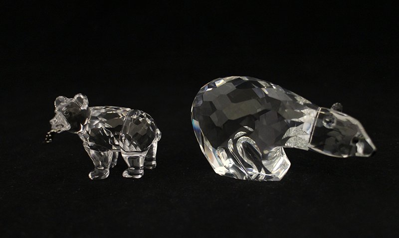 SWAROVSKI CRYSTAL BEARS: Two Swarovski crystal bear figurines. Polar bear and bear with fish in mouth.