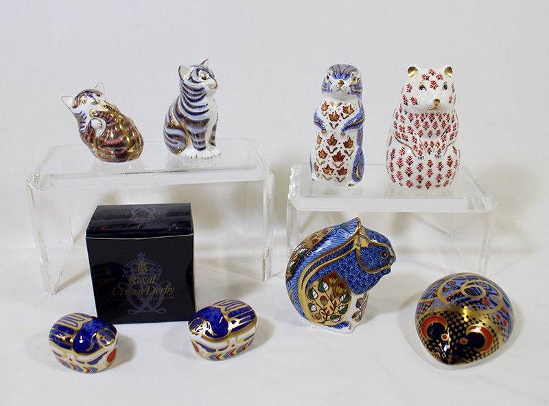 (8) ROYAL CROWN DERBY PAPERWEIGHTS: Eight Royal Crown Derby paperweights including (2) Millenium Bug (one with box), squirrel, cats, & more.