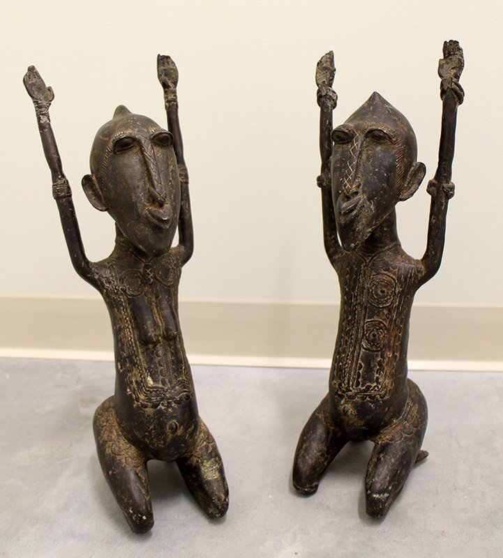 AFRICAN BRONZE FERTILITY FIGURES: Antique Senufu bronze fertility figures. Each measures 18 1/2" and 19 1/2" tall.