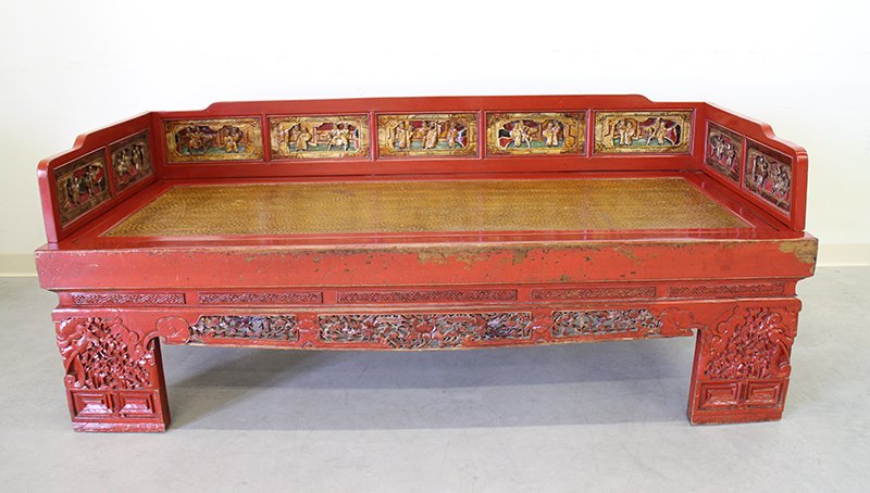 CHINESE OPIUM BED: Chinese carved wood opium day bed, painted red with various carvings. Measures 79" x 33 1/2" wide 21" tall to bed and 30 1/2" tall with rails.