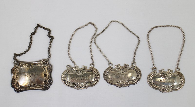 SILVER LIQUOR TAGS: (3) Sterling - Bourbon, Gin, & Scotch. One silverplate - Rye.