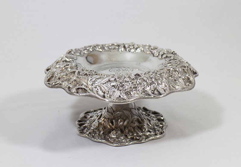 S KIRK STERLING SILVER REPOUSSE COMPOTE: Beautiful hand chased S. Kirk & Son sterling silver footed compote. Repousse flower designs along rim and base. Weighs 12.44 OZT and measures 7 1/2" wide 3 1/2" tall.