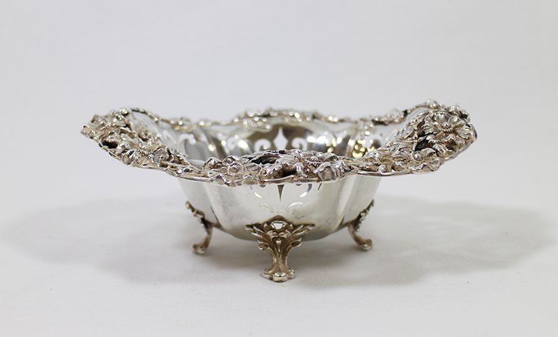BLACK STARR FROST STERLING FOOTED BOWL: Stunning Black Starr Frost New York sterling silver footed bowl. Bowl has a pierced design with flowers along rim. Weighs 6.16 OZT and measures 7" wide 2 3/4" tall.