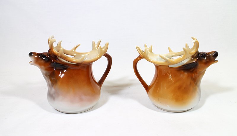 ROYAL BAYREUTH MOOSE CREAMERS: Two Royal Bayreuth moose creamers. One blue mark and one green mark. 4 1/4" and 4 1/2" tall.