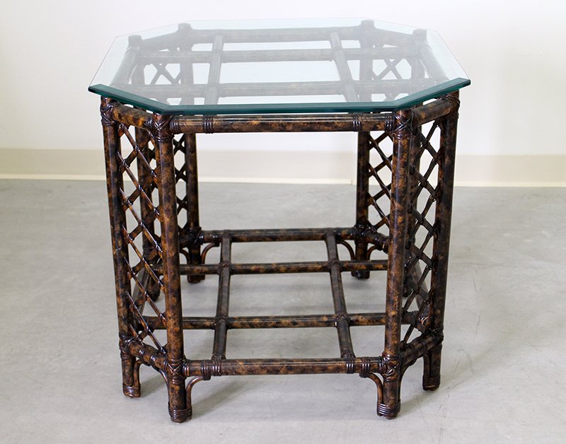 RATTAN & GLASS TABLE: Rattan side table with glass top. 26 1/4" tall 28" x 28" wide.