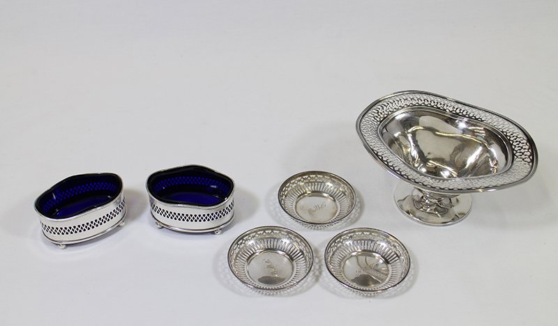 STERLING SILVER COLLECTION: Sterling silver salt cellars with cobalt blue glass, three sterling nut dishes, and sterling bowl. Total of 5 OZT.