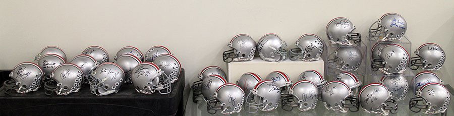 (35) AUTOGRAPHED OHIO STATE BUCKEYE MINI HELMETS: Collection of autographed Ohio State Buckeyes football helmets including Chris Carter, Eddie George, Archie Griffin, John Cooper, Earle Bruce, Jim Parker, Mike Vrabel, Joey Gallaway, Urben Meyer (w/ C