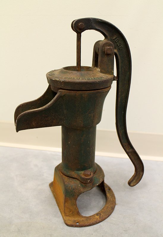 IRON COLUMBIANA HAND WATER PUMP: USA made water pump model 1038. Handle marked A19 and 1173. Measures 19" tall x 15" wide.