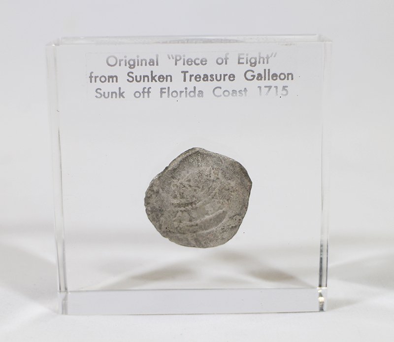 SUNKEN TREASURE GALLEON PIECE OF EIGHT COIN: 18th Century (c1715) Original "Piece of Eight" from the Sunken Treasure Galleon sunk off the Florida coast. Coin is encapsulated in acrylic measuring 2 3/4" x 2 3/4" wide.
