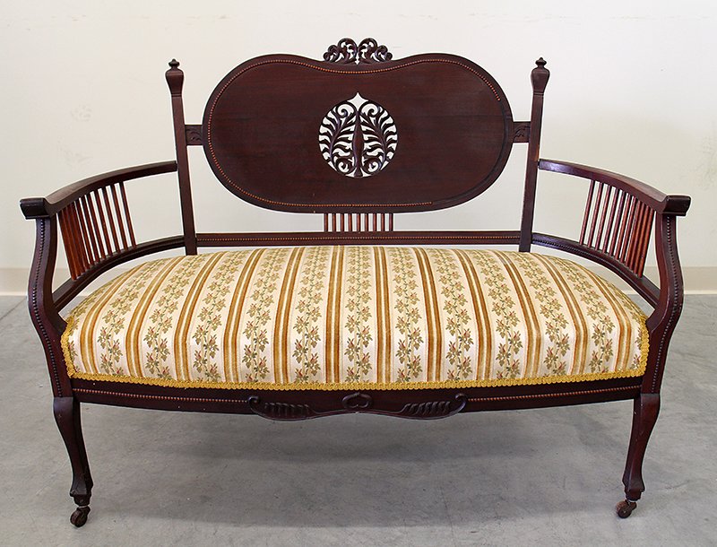 ANTIQUE SETTEE: Antique mahogany settee with kidney shaped carved back. 34" tall to back, 46" wide 21 1/2" depth. Some wear as espected from age, overall nice appearance.