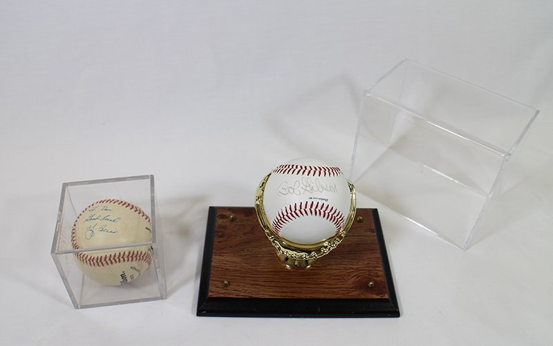 BOB GIBSON & YOGI BERRA AUTOGRAPHED BASEBALLS: Two autographed MLB baseballs, signed by Bob Gibson & Yogi Berra.