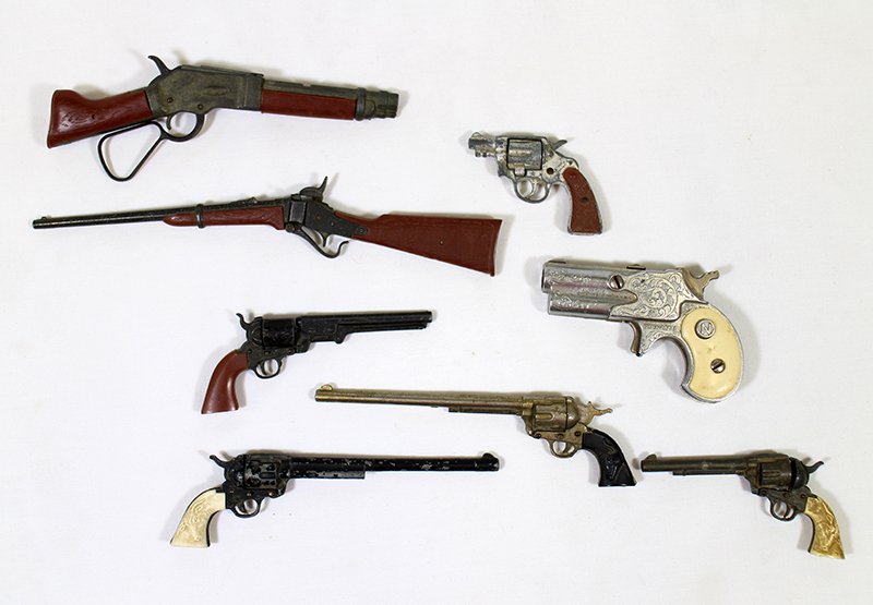 MINIATURE TOY GUN COLLECTION: Collection of miniature toy guns including a Nichols Dyna Mite pistol, a Mare's Laig Wanted Dead of Alive shot gun rifle, revolvers, & rifles. Guns measure 7 1/4" to 2 1/4" long.