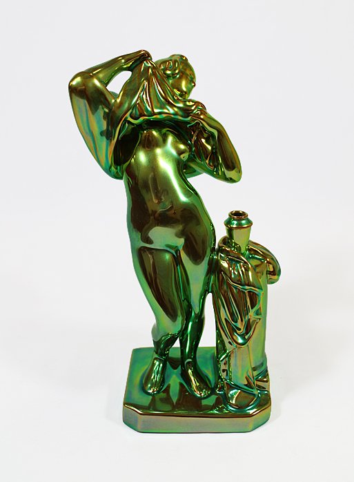 ZSOLNAY NUDE FIGURINE: Zsolnay green iridescent figurine of a nude woman undressing to bathe. 10 1/2" tall.