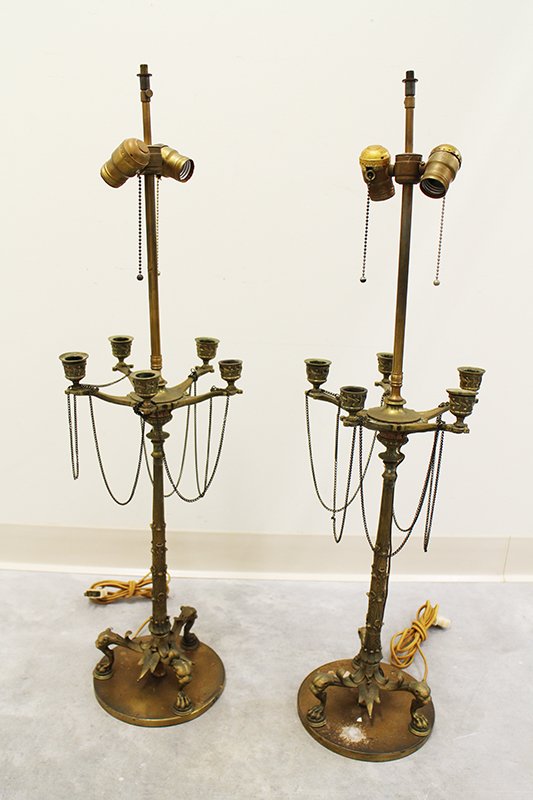 (2) 19TH CENTURY FRENCH EMPIRE LAMPS: Pair of French Empire brass candelabras converted into lamps. Panther cat head with hoof feet accents to base. 36" tall.