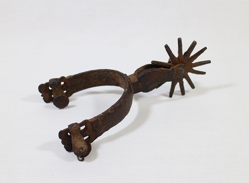 ANTIQUE HAND WROUGHT IRON SPUR: Hand wrought iron spur. Faint star hallmark, possibly August Buermann.