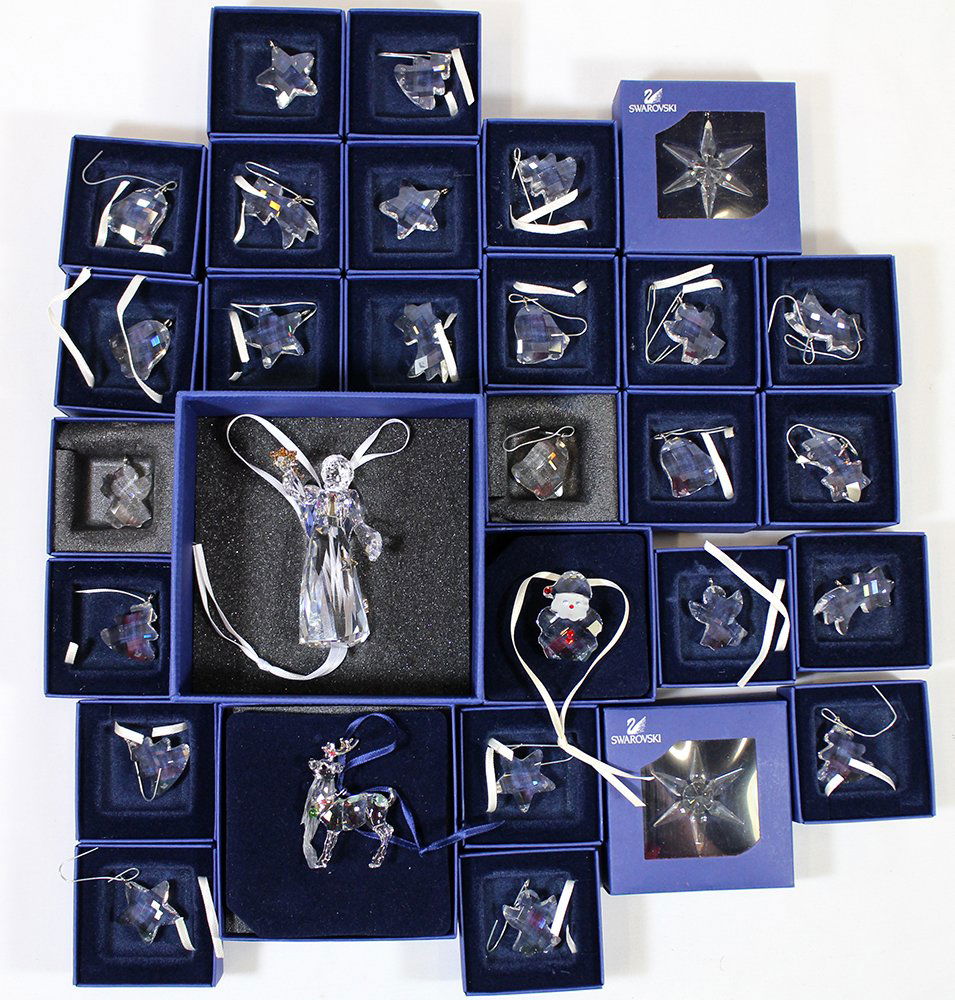 (30) SWAROVSKI CRYSTAL ORNAMENTS: 30 Swarovski crystal Christmas ornaments including angels, stars, bells, & more. One hand missing on large 2010 angel. All include boxes.