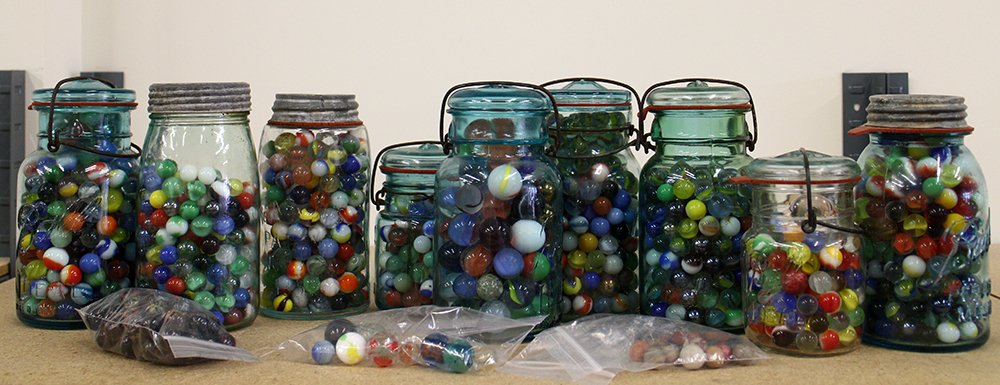 VINTAGE MARBLE COLLECTION: Large collection of assorted marbles in mason jars.