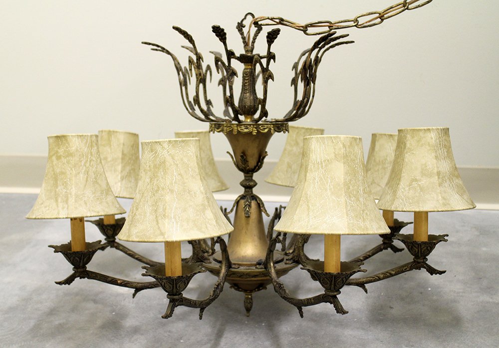 VINTAGE METAL CHANDELIER: Vintage/antique metal chandelier with 8 lights. Approximately 20" tall 28" wide.