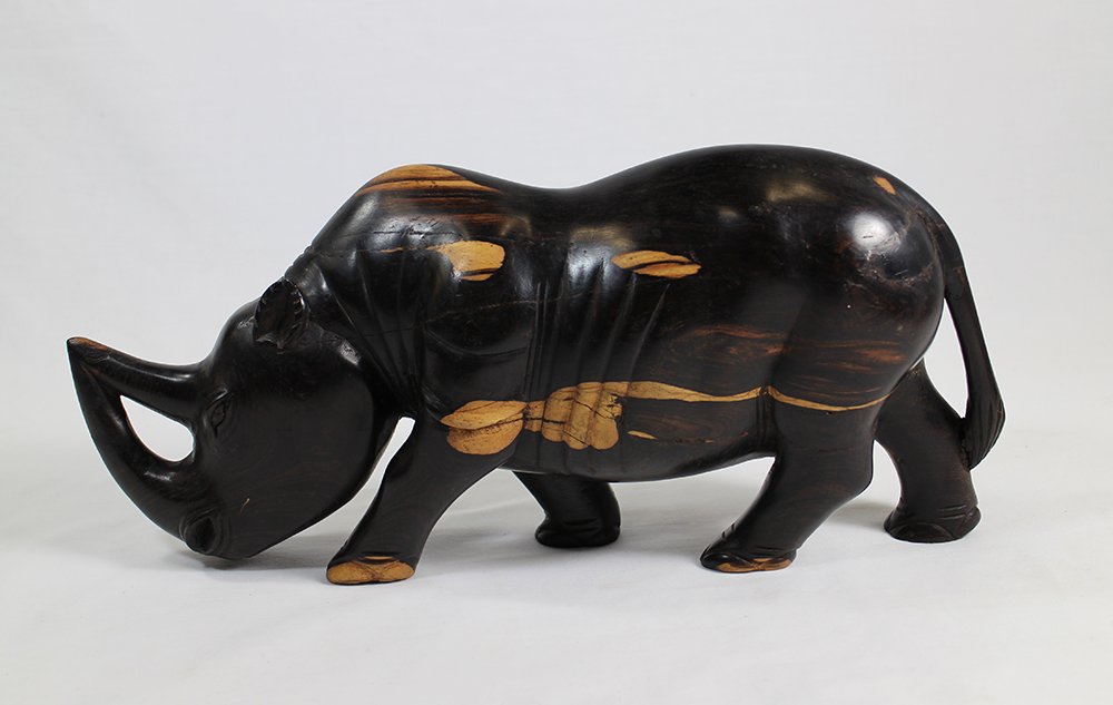 EBONY WOOD RHINOCEROS: Ebony wood, dark with some light tones, rhino. Some normal cracking to wood. 14" long.