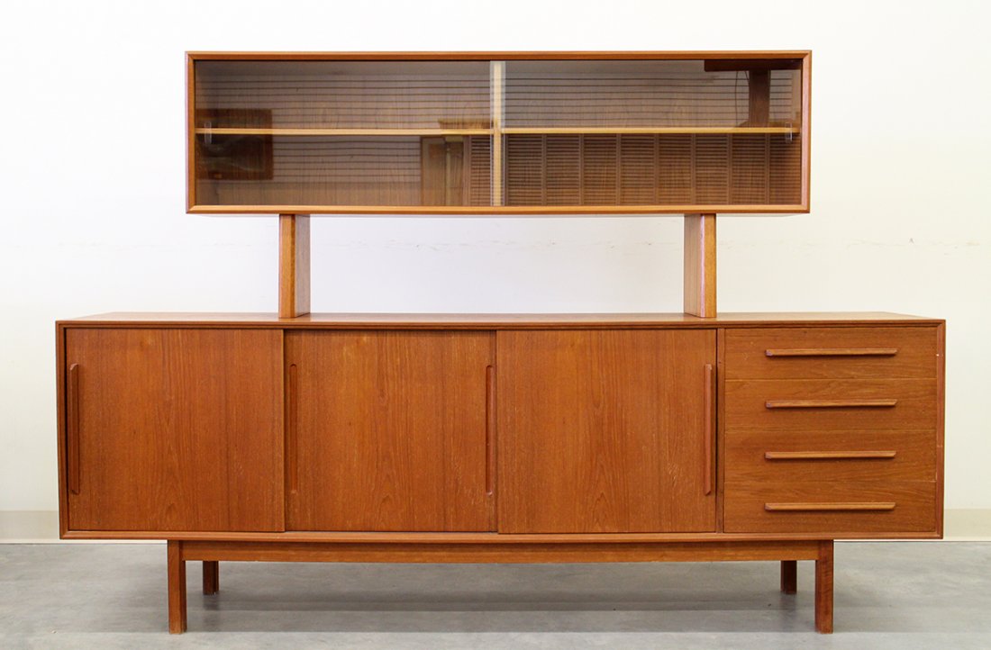 MID CENTURY MODERN SIDEBOARD: Faarup Mobelfabrik Mid Century Modern Danish sideboard. Original label on back. Top with two sliding glass doors. Measures 54 1/4" tall 80 1/2" wide 17" depth.