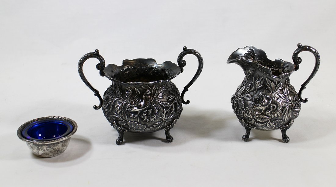 STIEFF STERLING CREAMER & SUGAR: Stieff footed repousse sterling silver creamer and sugar # 27 and misc sterling & cobalt blue glass salt cellar. 11.73 OZT.