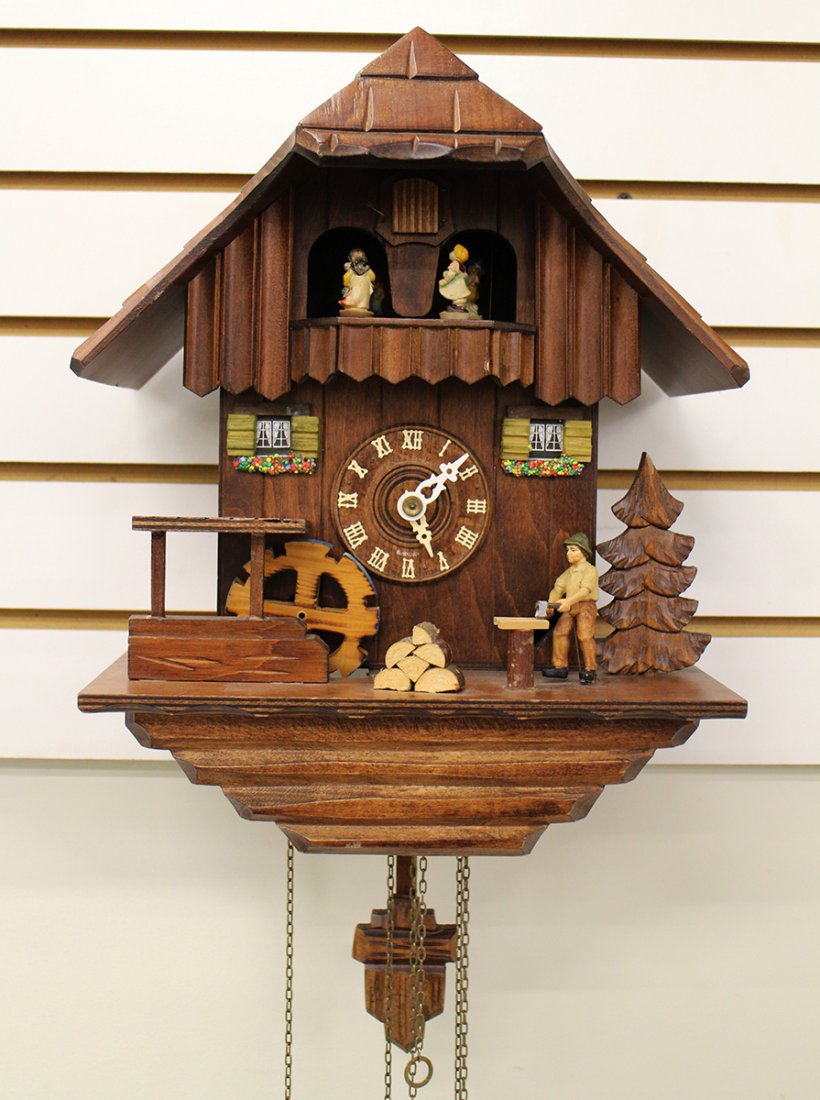 GERMAN CUCKOO CLOCK: German cuckoo wall clock. 13" tall 10 1/4" wide. One chain loose.