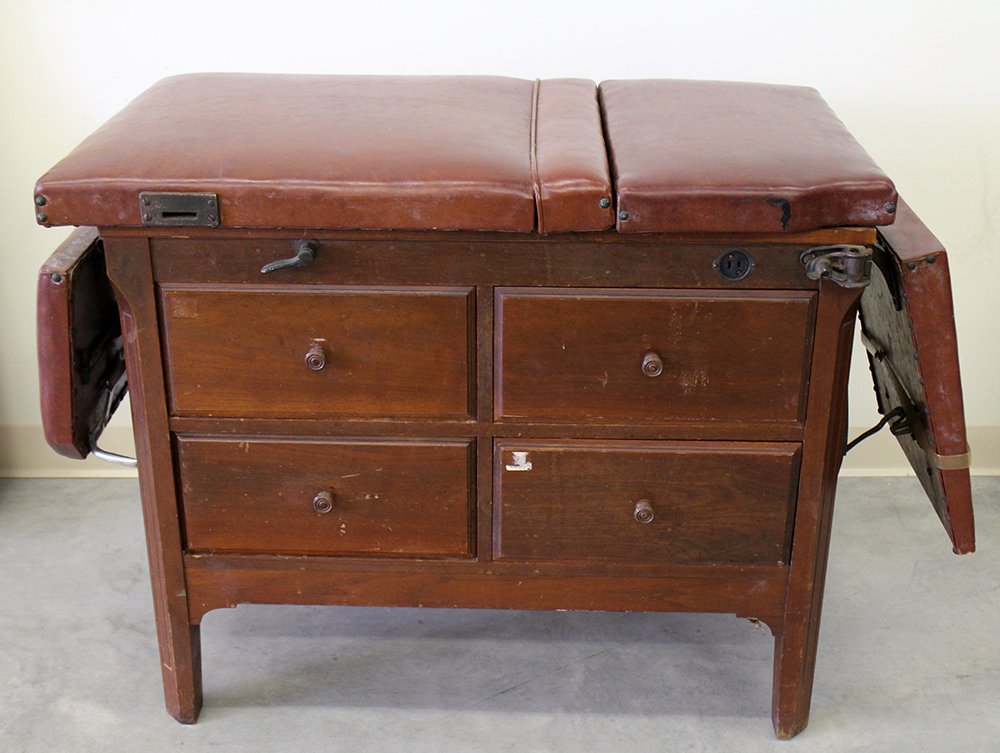 ANTIQUE MEDICAL EXAM TABLE: Antique medical exam table with stirrups. Measures 39" x 22" wide 32" tall.