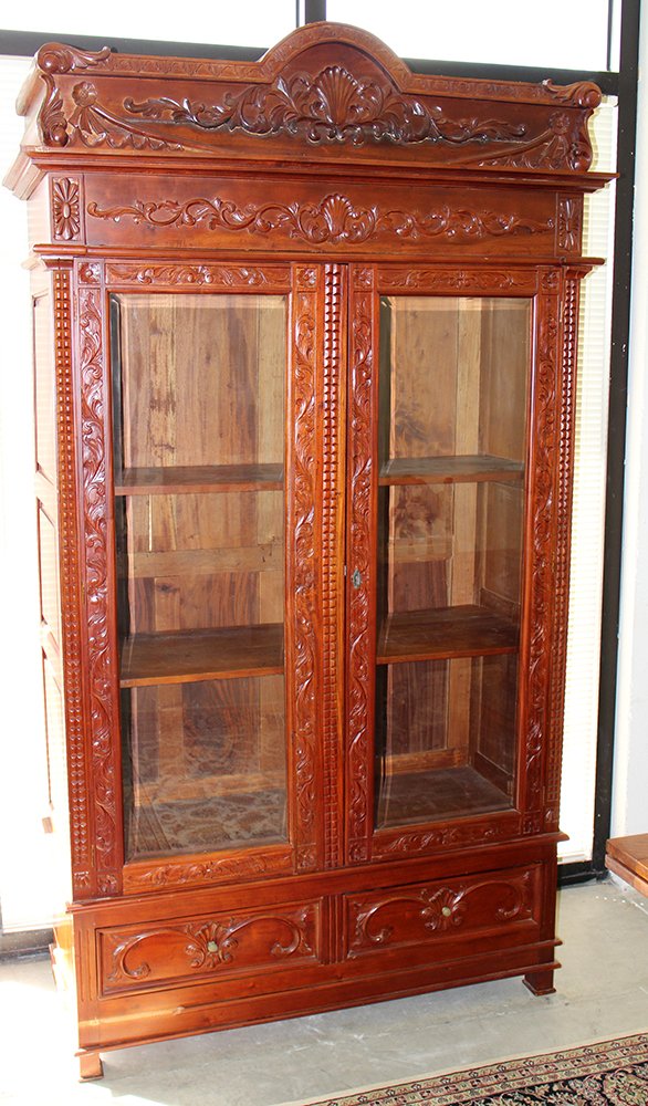 TALL CARVED WOOD CURIO CABINET: Tall curio cabinet with carved wood shell accents. Some losses to trim around bottom. 95 1/2" H 49 1/2" W 23" D.